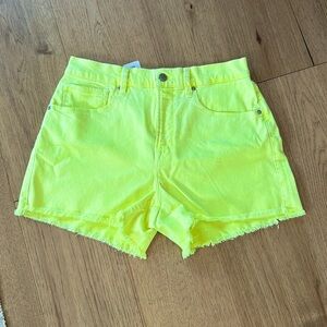 Good American bright yellow cut off jeans shorts